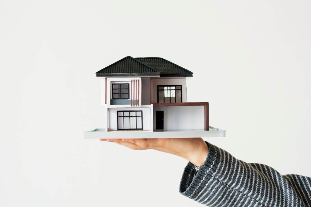 hand-presenting-model-house-home-loan-campaign (1)